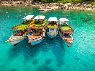 Top aerial view of  natural bay serving ton of traveler tourist  take bundle of tour boats dropped...