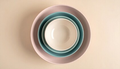 Beautifully stacked ceramic bowls minimalist kitchen setting still life photography soft color palette top view elegance