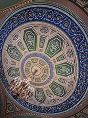 chandelier hanging from a dome clicked from below creating beautiful patterns