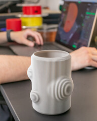 Intricately carved, surreal ceramic vessel echoes the spirit of modern craftsmanship and Diwali creativity; 3D printer, 3D printing