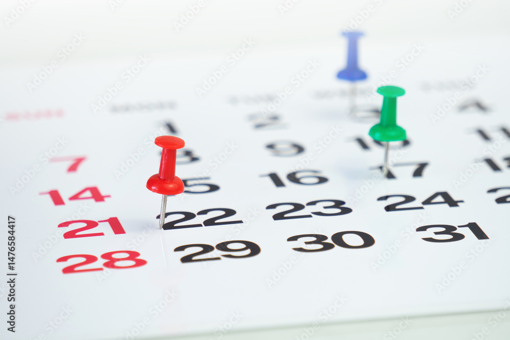 Poster deadline concept with push pin on calendar date