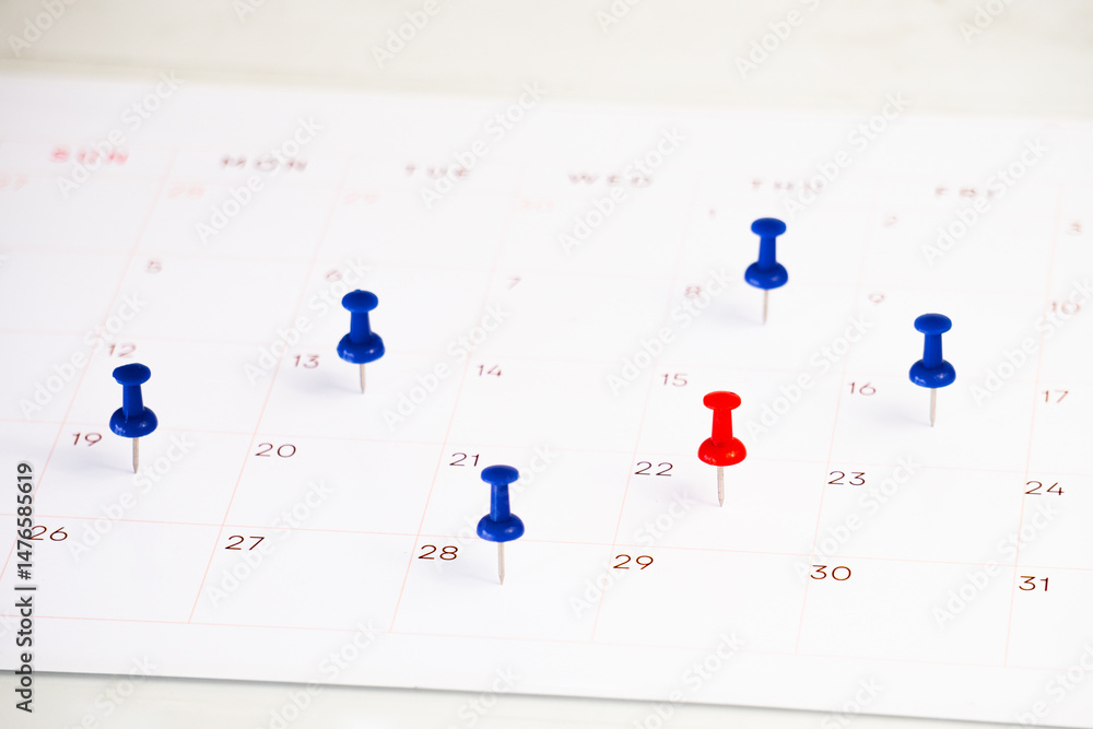 Poster date marked push pin on calendar for background