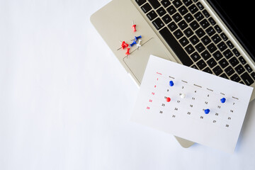 background of schedule markers in the calendar agenda with laptop