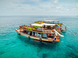 Top aerial view of  natural bay serving ton of traveler tourist  take bundle of tour boats dropped...