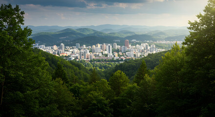 Scenic City View Surrounded by Lush Green Mountains and Forests