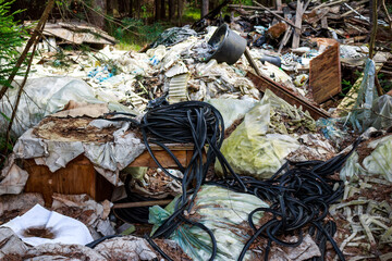 Illegal dump of rubber and polyethylene waste in the forest