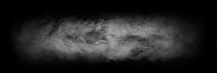 Abstract smoke texture over black background. Fog in the darkness.
