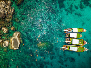 Top aerial view of  natural bay serving ton of traveler tourist  take bundle of tour boats dropped anchorage let people enjoy water sport together  in summertime Thailand travel and visiting