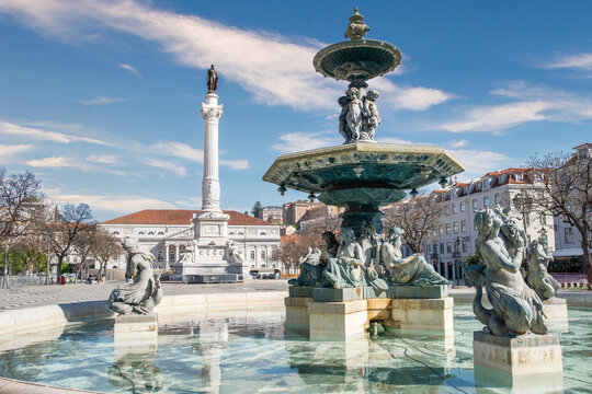 Water fountain and the Dom Pedro IV Column in Praca do Rossio, Rossio Square, Lisbon, Portugal