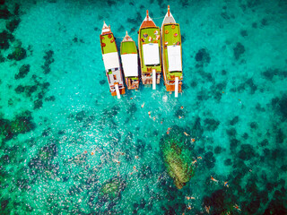 Top aerial view of natural bay serving ton of traveler tourist take bundle of tour boats dropped anchorage let people enjoy water sport together in summertime Thailand travel and visiting