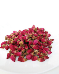 isolated dried red rose buds