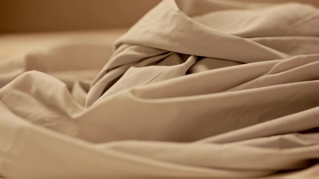 Beige Fabric Folds: Soft Texture and Gentle Light