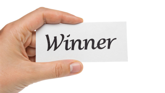 hand holding paper with winner word isolated