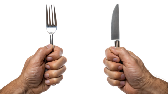 A hands holding silver fork and knife isolated