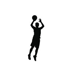 Silhouette of a basketball player shooting the ball during a game competition isolated