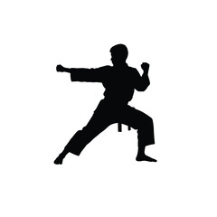 Silhouette of a karateka in a focused stance executing a punch on white background