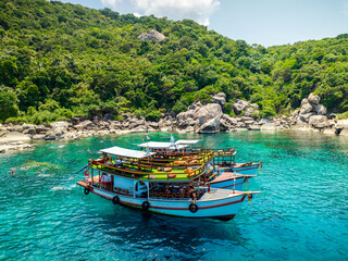 Top aerial view of  natural bay serving ton of traveler tourist  take bundle of tour boats dropped anchorage let people enjoy water sport together  in summertime Thailand travel and visiting