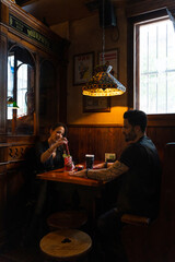 Couple enjoying drinks at traditional irish pub
