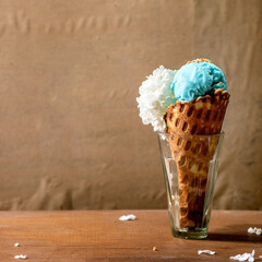 Turquoise ice cream in waffle cone
