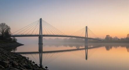 Obraz premium Misty sunrise over a cable-stayed bridge