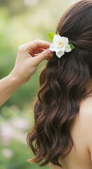 Naklejka premium Woman with flower in hair fashion style