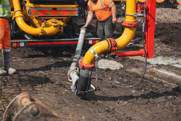 Close-up of mobile concrete pump pipes on construction site