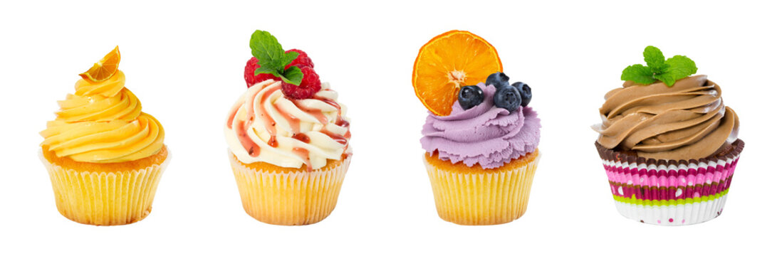 assorted cupcakes with different toppings on white background