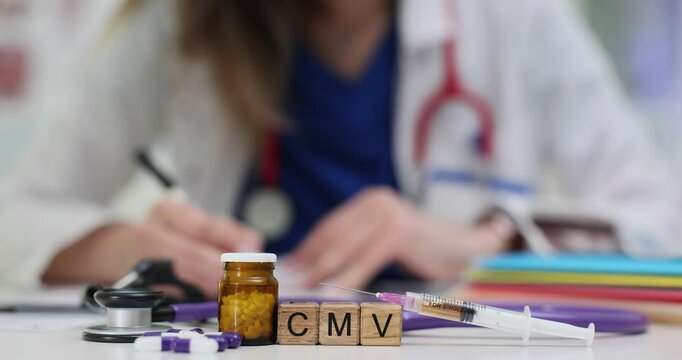 Female doctor writes prescription for CMV treatment with medication syringe and stethoscope. Healthcare and medical research for cytomegalovirus