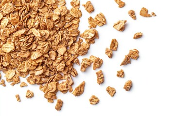 Scattered toasted oat flakes on white background.  Crispy, golden-brown flakes