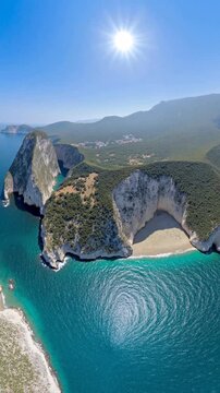 Aerial view of a beach, cliff above the water - 360 loop video