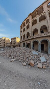 Destroyed buildings in the streets of a city, clear sky, war torn city - 360 loop video