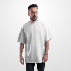 Obraz premium Template of a white oversized t-shirt on a bearded man in black jeans, front view, for design, print, pattern, branding.