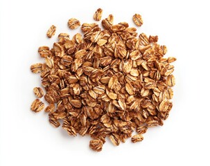 Pile of whole grain oat flakes, scattered atop a plain white background.  Close-up view shows numerous small, irregular-shaped pieces, light tan to golden brown in color