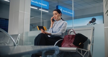 International Airport Terminal: Successful Businesswoman Talking on Mobile Phone, Waiting for...