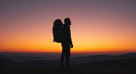Silhouette of hiker at sunset