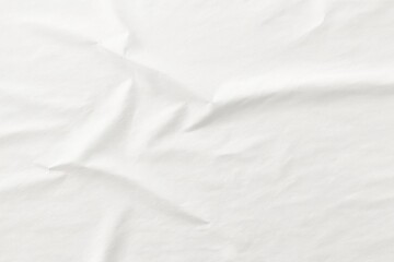 Fototapeta premium crumpled white paper texture, glued poster pattern with wrinkles for mockup, abstract background