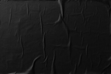 Crumpled black paper texture, glued poster pattern with wrinkles for mockup, abstract background