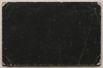 Vintage aged scratched black paper texture with torn corners. Abstract background, design overlay.
