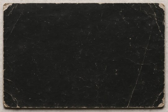 Vintage aged scratched black paper texture with torn corners. Abstract background, design overlay.