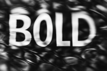 Abstract black letters on white background with distressed, grunge texture.