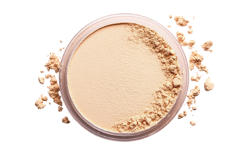 Beige face powder in a round container.  Loose powder scattered around the container