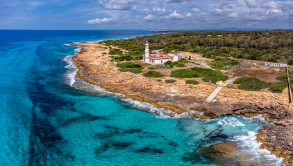 Obraz premium Punta de la Salinas lighthouse and the area of ​​influence of the Cabrera National Park, Cap de Ses Salines, Santanyi, Mallorca, Balearic Islands, Spain