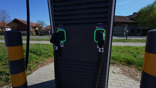 EV charging station in Germany with designated parking for electric cars. Modern solution for sustainable urban mobility, reducing emissions and promoting clean energy in residential areas. 