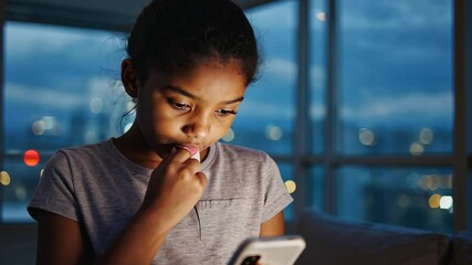 Worried teenager using cell phone. - Powered by Adobe