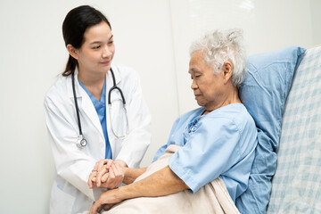 Fototapeta premium Asian doctor checking and treat elderly woman patient health in hospital.