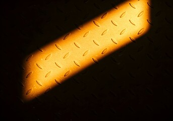 Metal surface with brushed texture and realistic light reflections, industrial theme