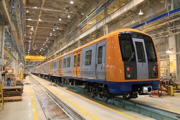 Fototapeta premium Dynamic Industrial Train Construction in Factory Setting 