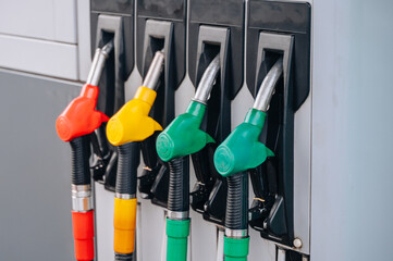Gas station. Pistols with gasoline and diesel fuel at a car gas station, oil business concept. High...