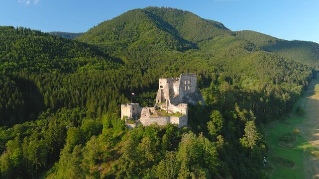 Likava Castle or Likavsky hrad. One of the largest castles in central Slovakia. Late Gothic and Renaissance testament. Well-preserved ruins surrounded by sunset panorama of Liptov and Choc Mountains.