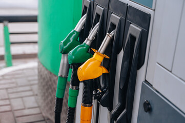 Gas station. Pistols with gasoline and diesel fuel at a car gas station, oil business concept. High quality photo